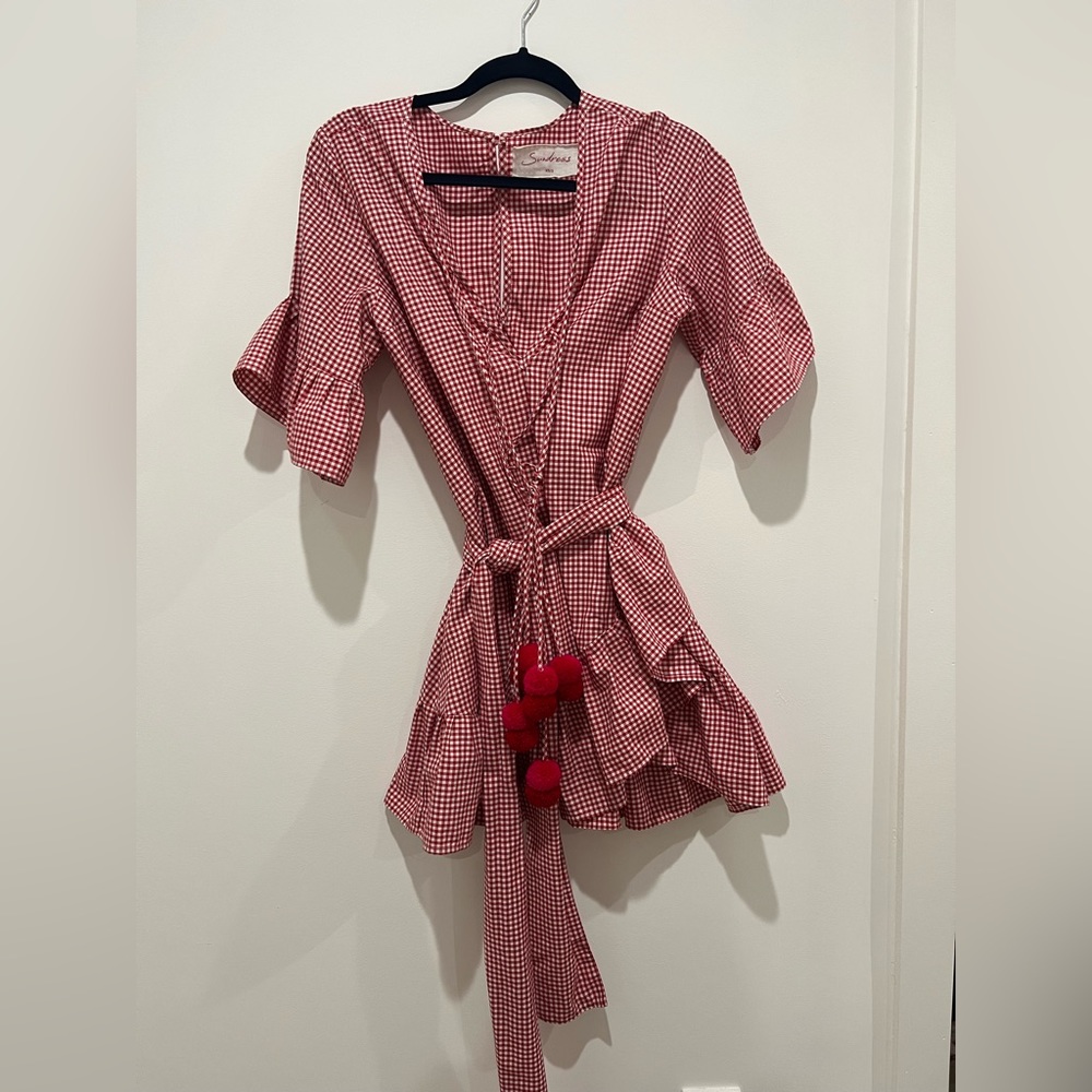 Red and white mini dress with pink and red Pom pom accent and tie waist